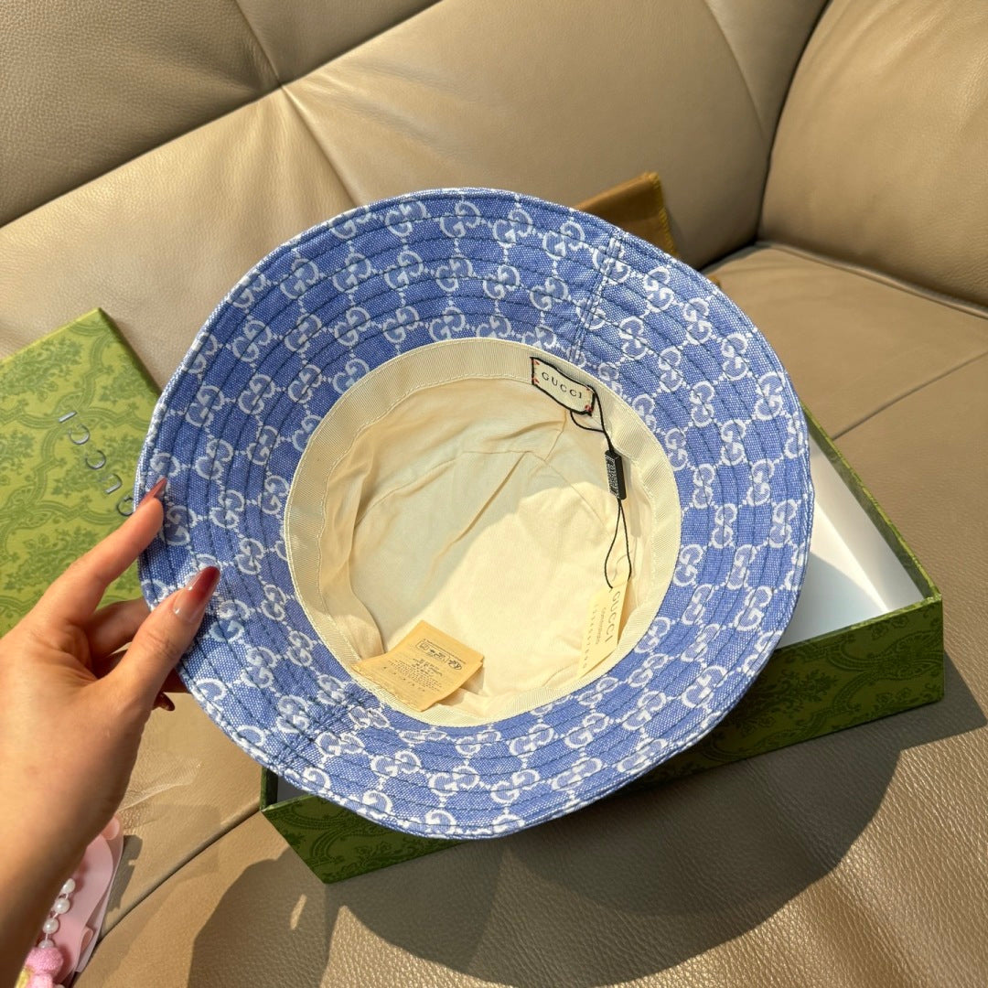 Gucci bucket hat inside view in blue GG monogram fabric with label tag