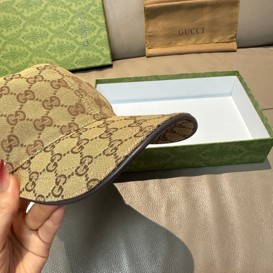 Gucci baseball cap in beige GG canvas with dark underside brim.
