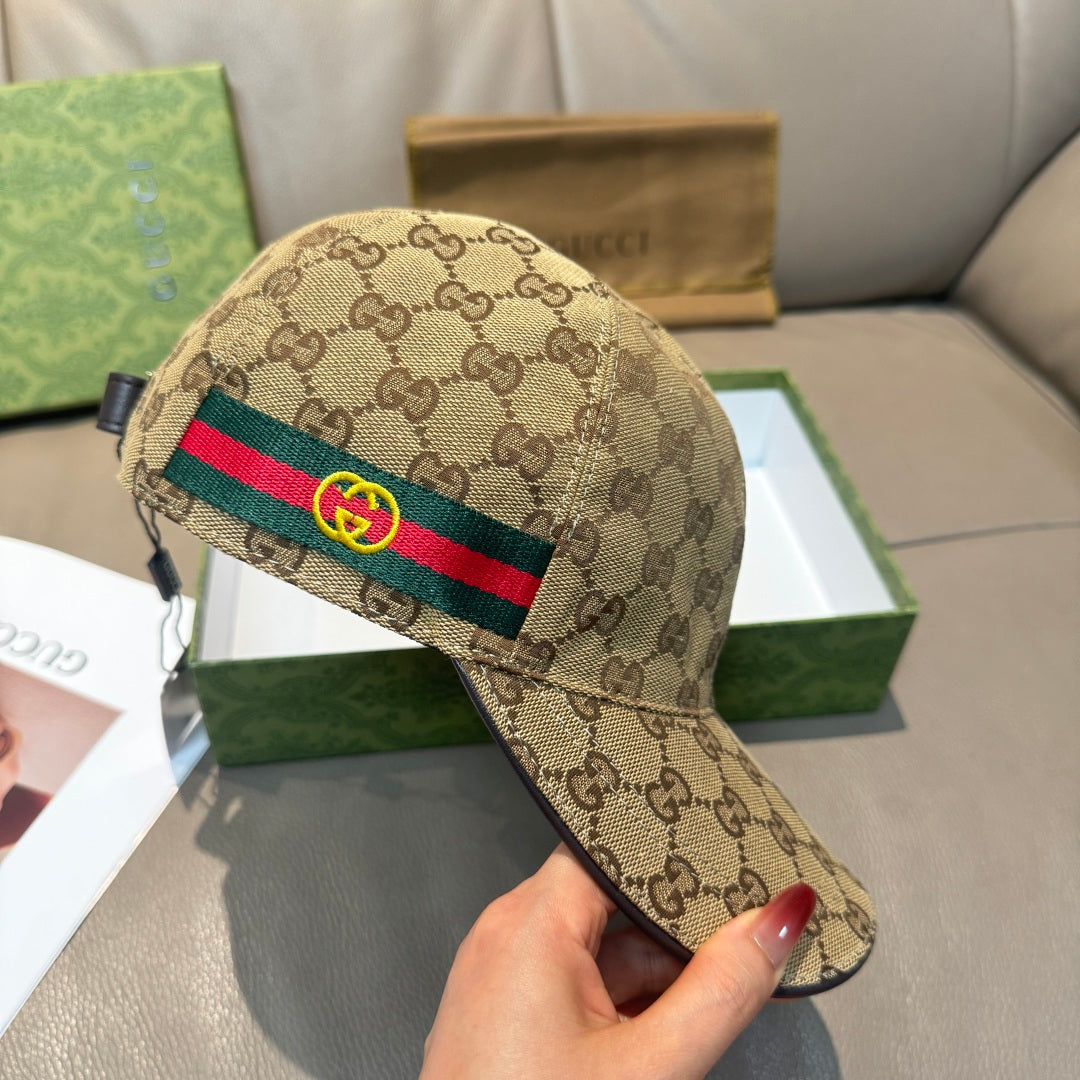 Gucci baseball cap in beige GG canvas with multicolor stripe across the front.