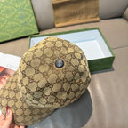 Gucci baseball cap in beige GG canvas with round top button.