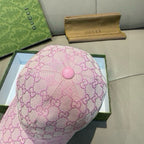 Gucci pink GG jacquard cap with round pink top button and quilted crown.