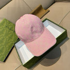 Gucci pink GG jacquard baseball cap with curved brim and stitched side panels.