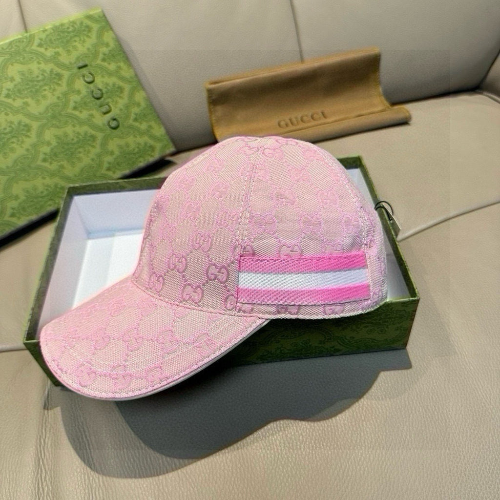 Gucci pink GG jacquard cap with pink brim and striped front band.