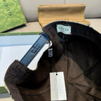 Interior view of baseball cap with black adjustable strap and Gucci label