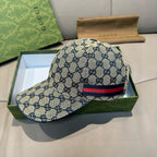 GG logo baseball cap in light beige with navy, red, and blue web stripe