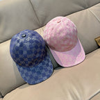 Pair of monogram baseball caps: blue and pink with curved brims
