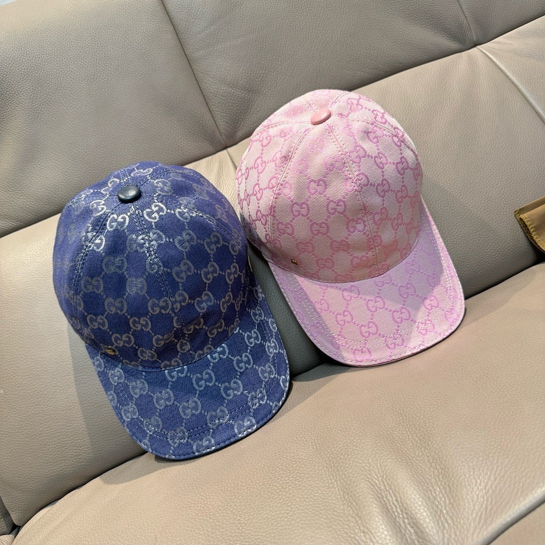 Pair of monogram baseball caps: blue and pink with curved brims