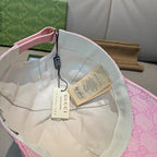 Pink monogram baseball cap interior view with trim and hanging label tags