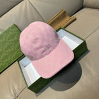 Pink monogram baseball cap with curved brim and embroidered logo detail