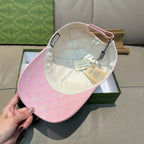 Pink monogram baseball cap interior with white lining and hanging tags