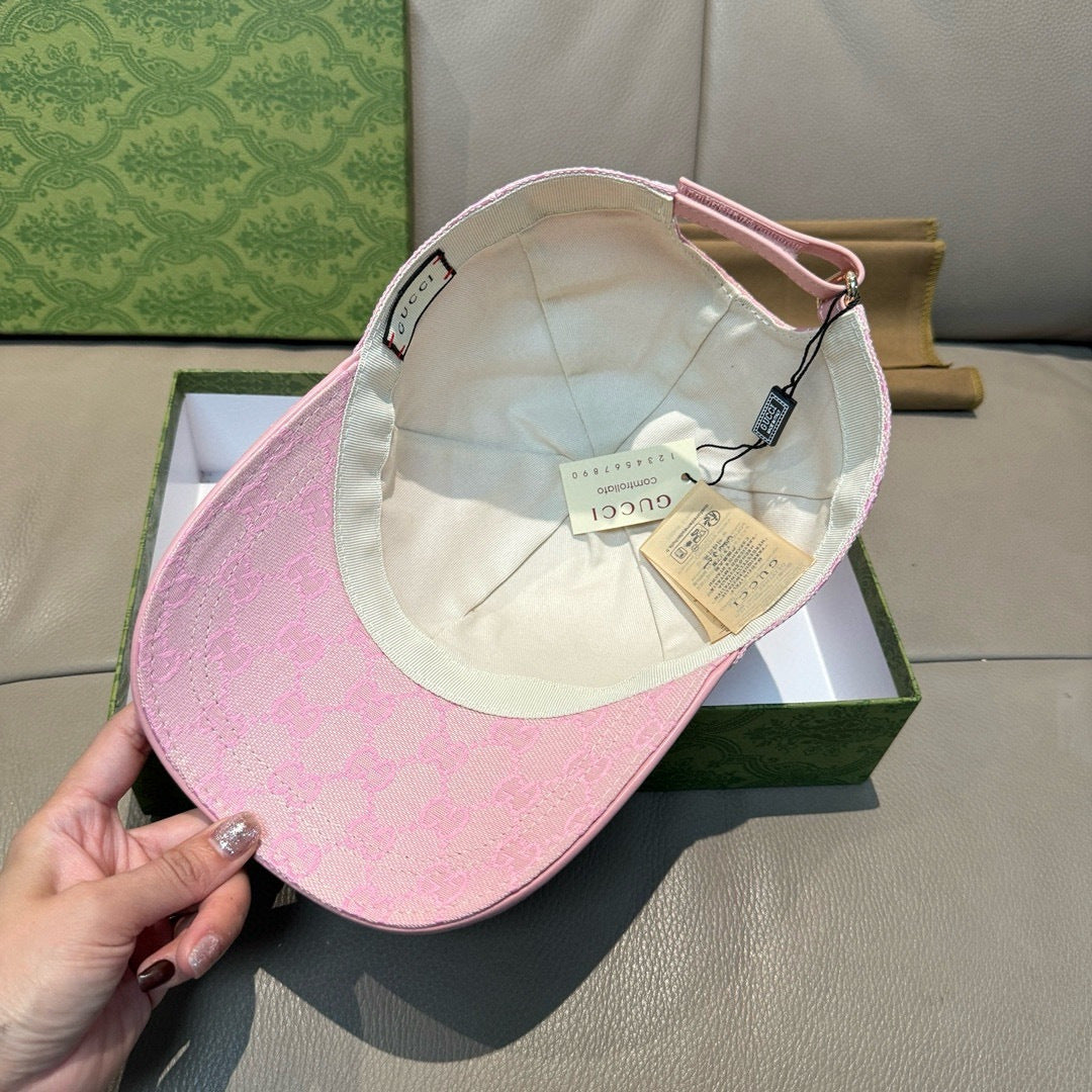 Pink monogram baseball cap interior with white lining and hanging tags