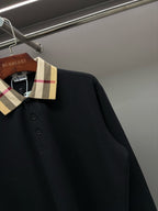 Burberry long-sleeve polo shirt collar detail, black with check trim and buttons