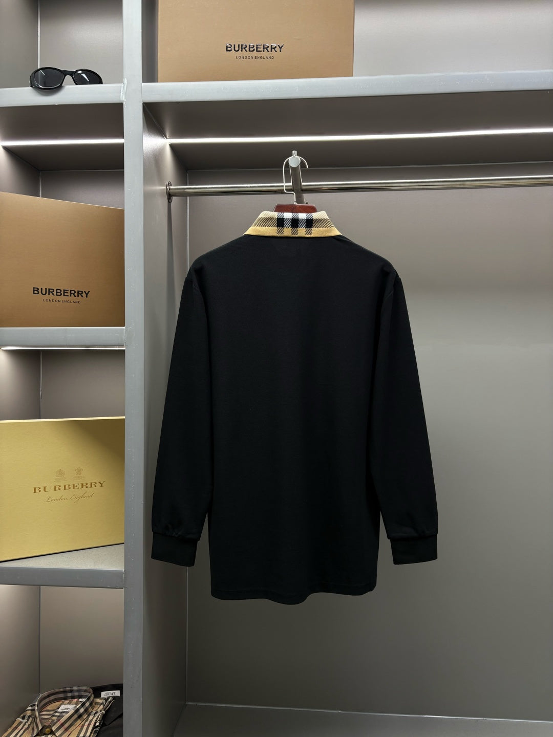 Burberry long-sleeve polo shirt back view, black with check collar