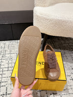Brown suede Fendi sneakers outsole view with embossed pattern on the bottom
