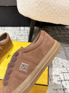 Brown suede Fendi sneakers close-up with side FF logo and lace trim