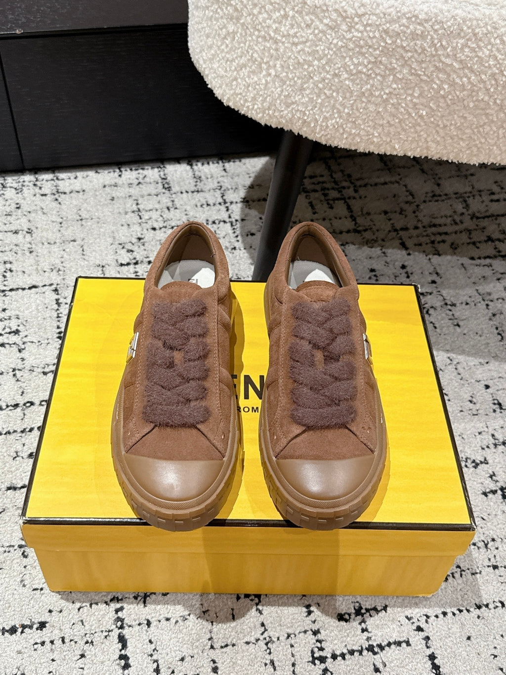 Brown suede Fendi sneakers with plush lace trim, shown as a pair from the front
