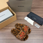 Balenciaga leopard-print faux-fur slide sandals with red embroidered strap, angled view