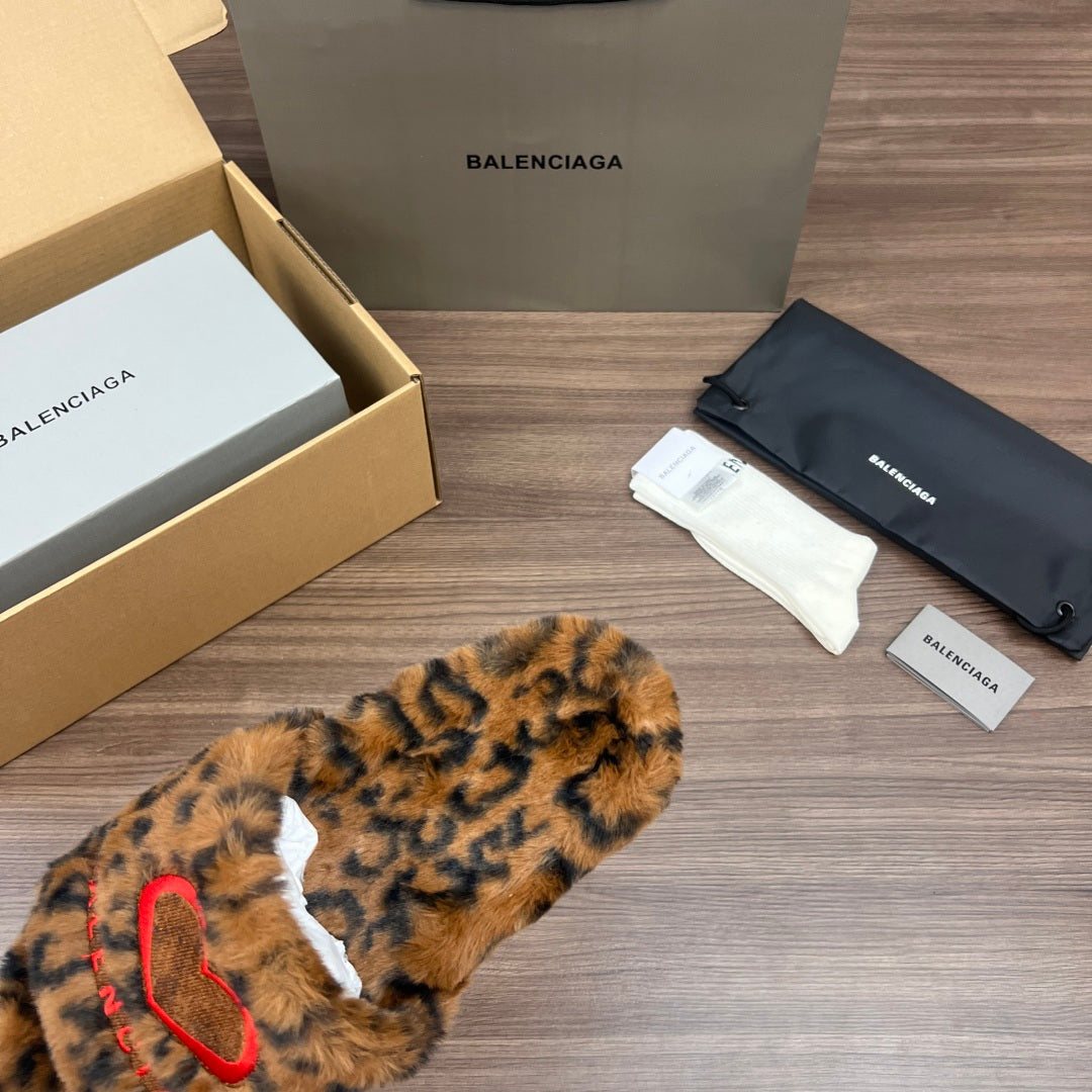 Balenciaga leopard-print faux-fur slide sandals, angled pair view with white lining
