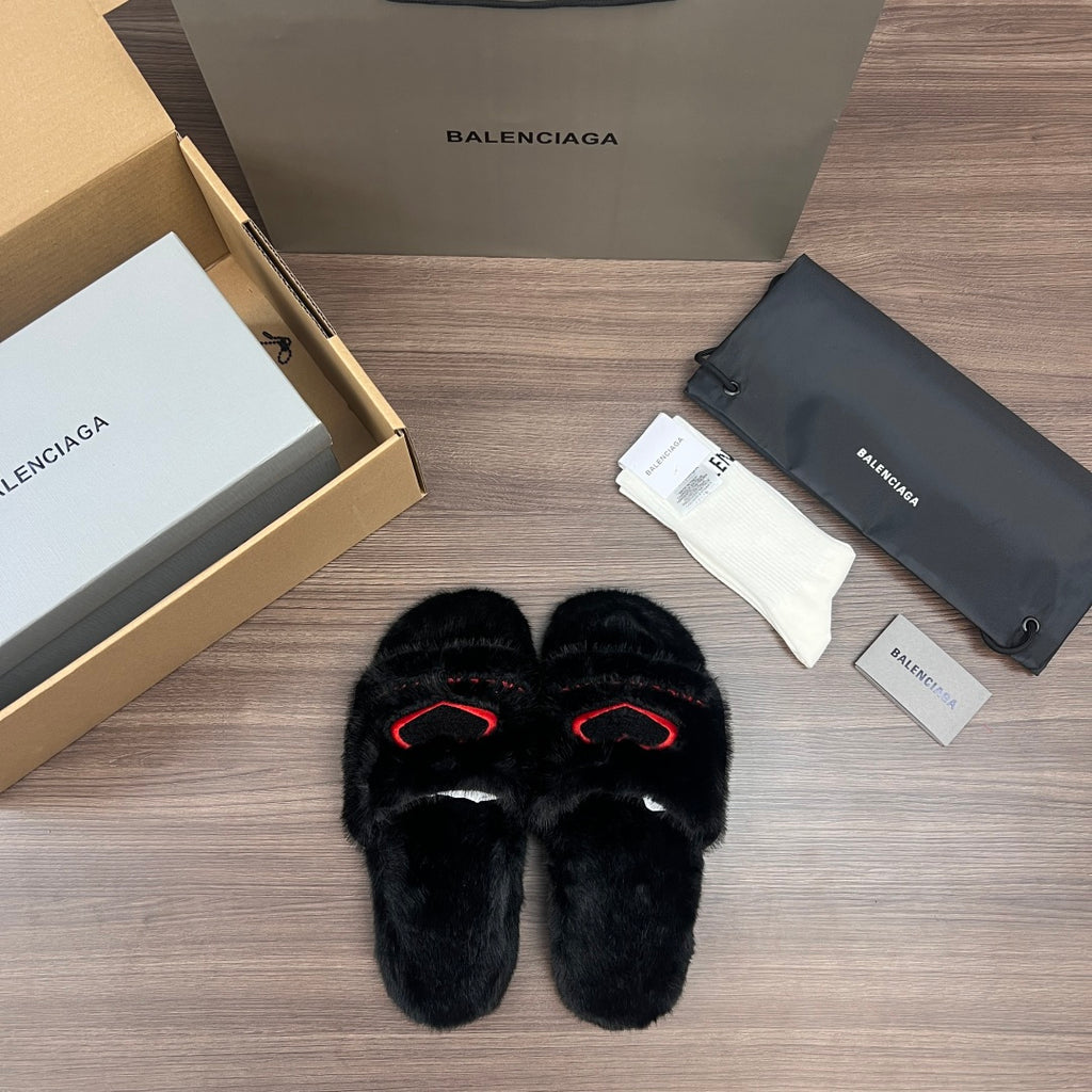 Black plush slide sandals with red logo outline, front view