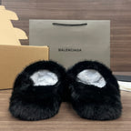 Black plush slide sandals with cushioned white lining, top view