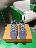 Unisex blue-gray lace-up sneakers with green geometric side patch and light laces