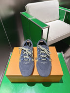 Unisex blue-gray lace-up sneakers with green geometric side patch and light laces