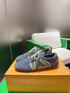 Unisex blue-gray lace-up sneakers with contrast green graphic panels and light laces