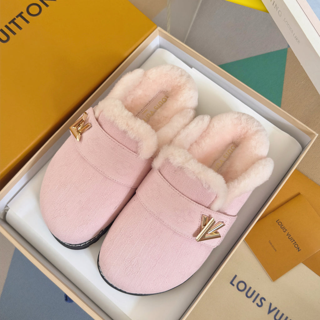 Pink plush slide sandals with cushioned lining, gold V logo, and dark rubber sole