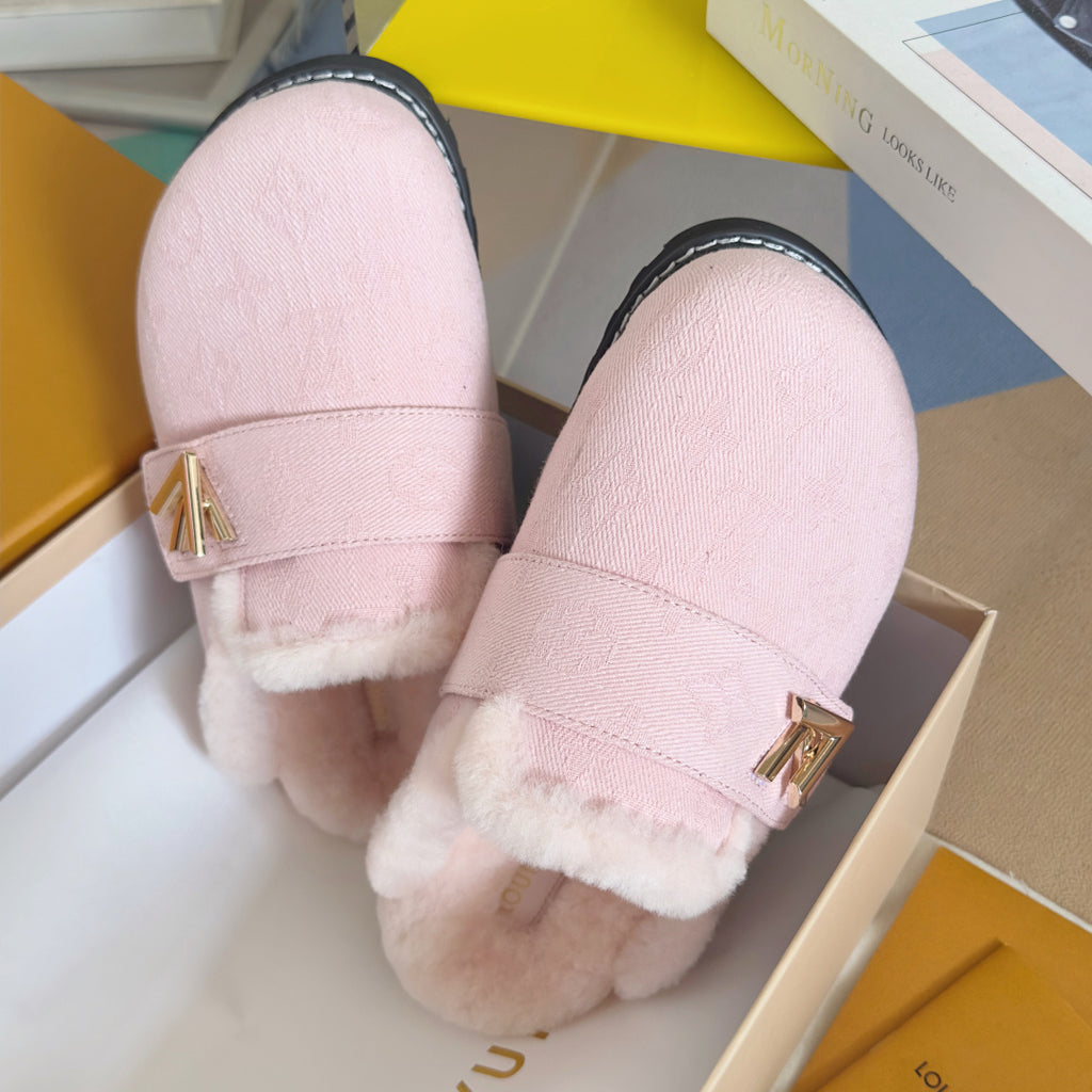 Pink plush slide sandals shown from side, with gold V logo and dark sole