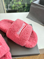 Balenciaga pink plush slide sandal with embroidered logo band across strap