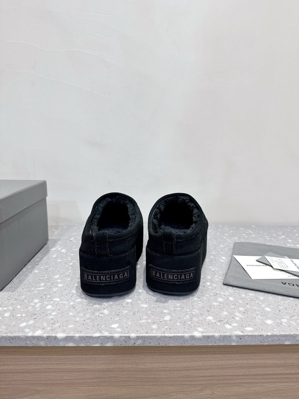 Balenciaga suede slip-on sandals in dark navy, heel view with Balenciaga logo
