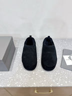 Dark blue suede slip-on sandals with rounded toe
