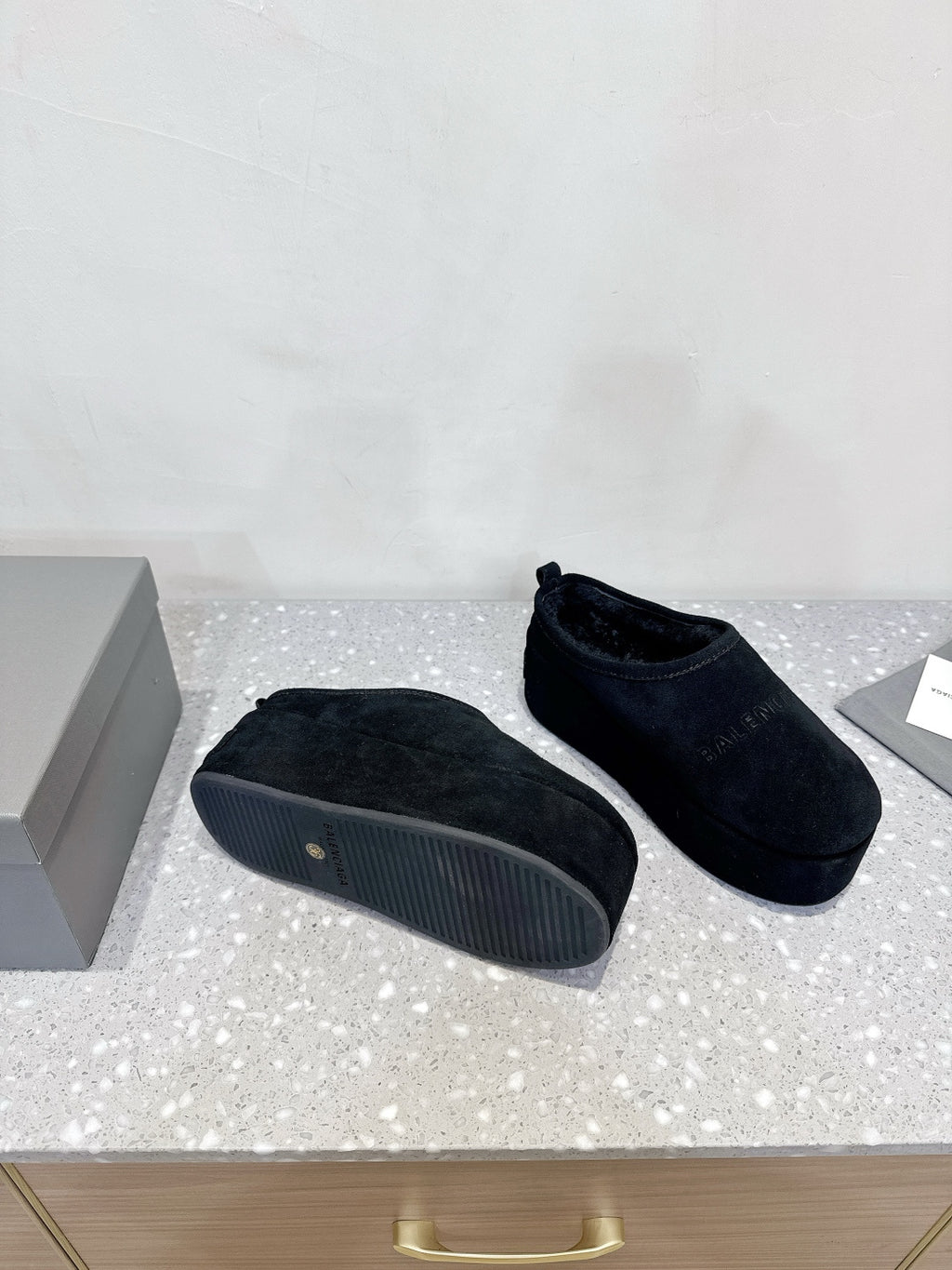 Dark blue suede slip-on sandals with textured rubber outsole