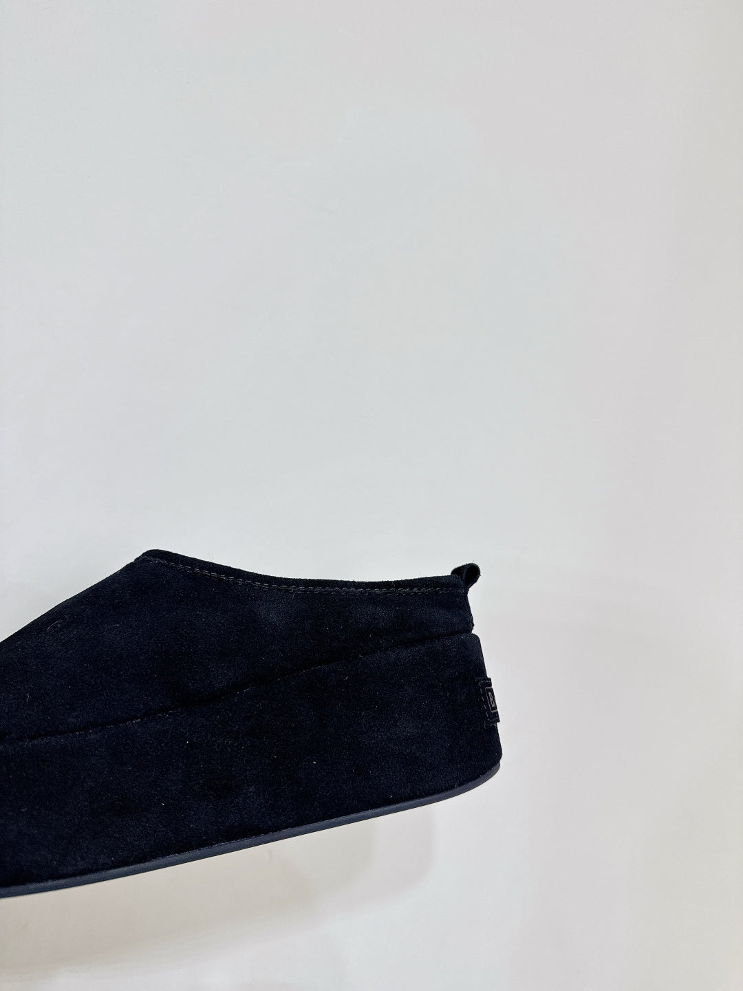 Dark blue suede slide sandal upper with small back bow