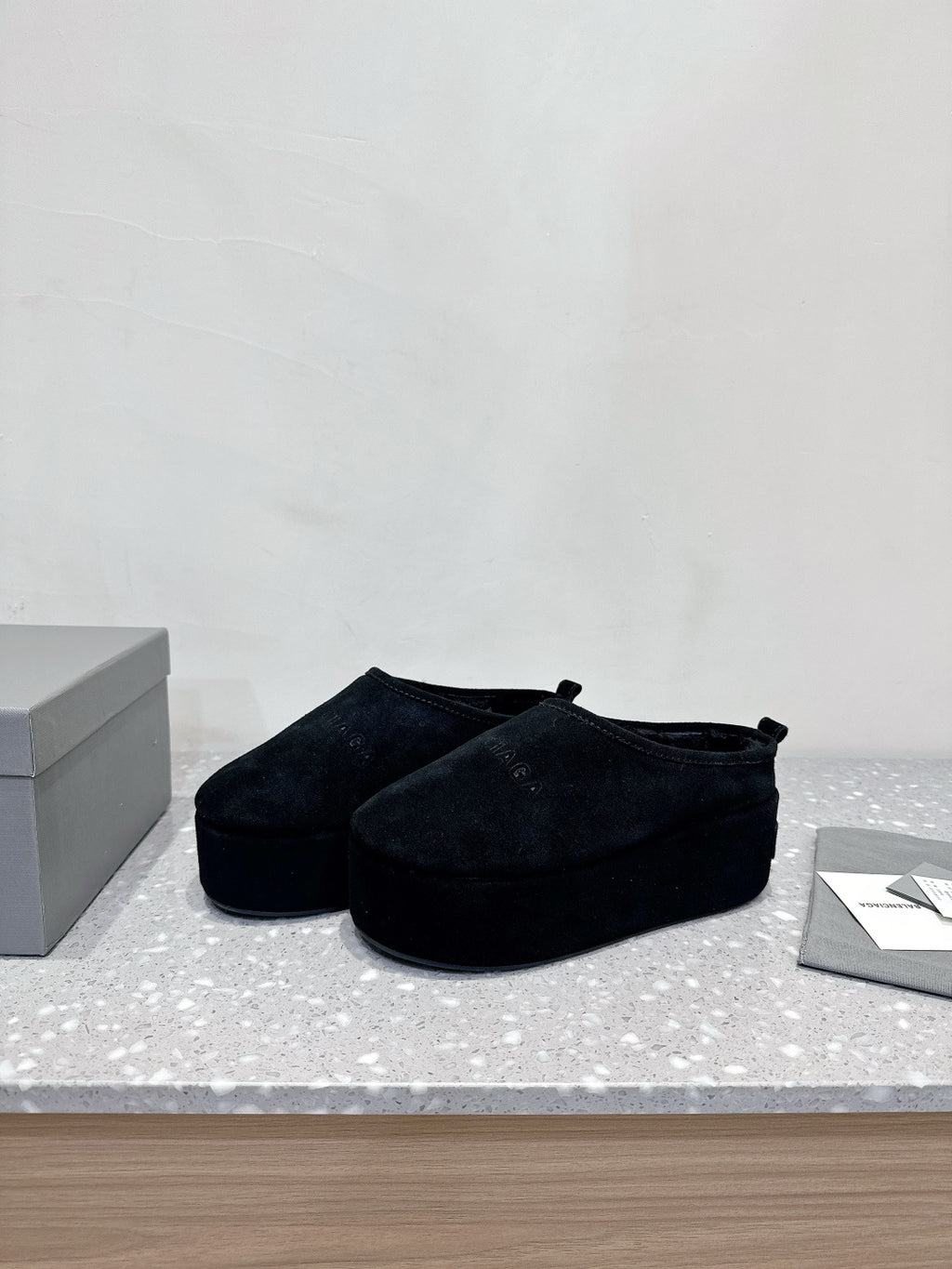 Balenciaga suede slip-on sandals in dark navy, front-left side view pair