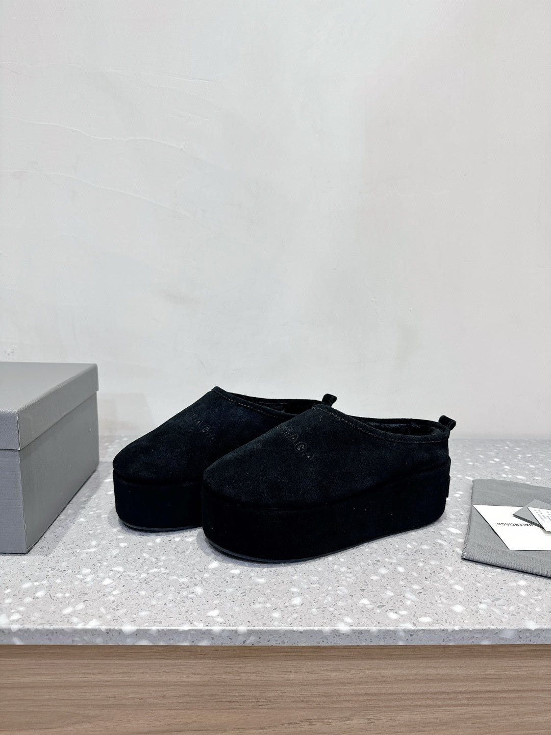 Balenciaga suede slip-on sandals in dark navy, front-left side view pair