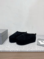 Dark blue suede slip-on sandals with low platform sole