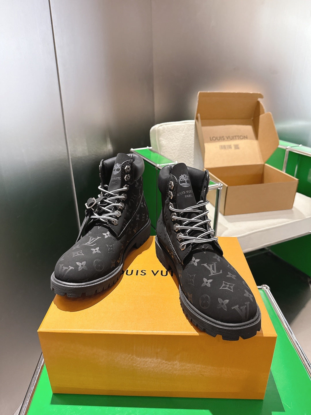 Louis Vuitton monogram lace-up boots, side view on yellow box with laces