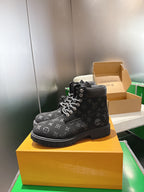 Louis Vuitton monogram lace-up boots, single boot front on yellow box