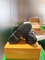 Louis Vuitton monogram boot outsoles, tread bottoms on yellow box