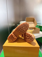 Louis Vuitton unisex lace-up boots, tan rubber soles with tread pattern
