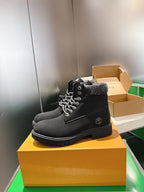 Louis Vuitton unisex black lace-up boots, side view with metal eyelets