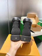 Louis Vuitton unisex black boots heel view, showing branding on back