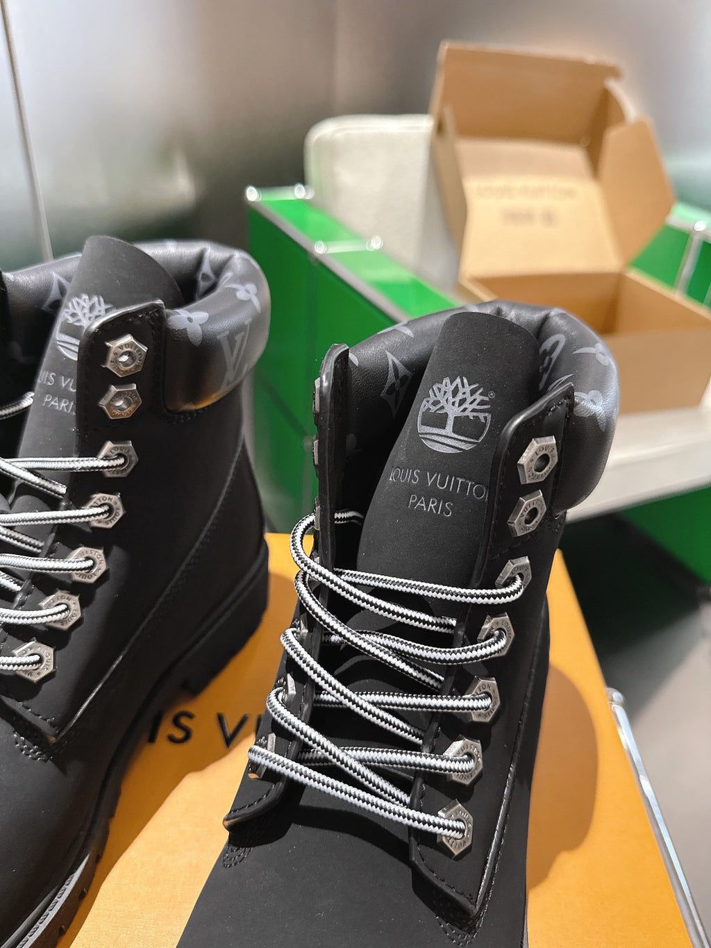 Louis Vuitton unisex black lace-up boots close-up of heel and back logo