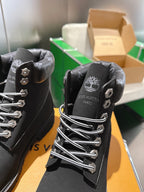 Louis Vuitton unisex black lace-up boots close-up of heel and back logo