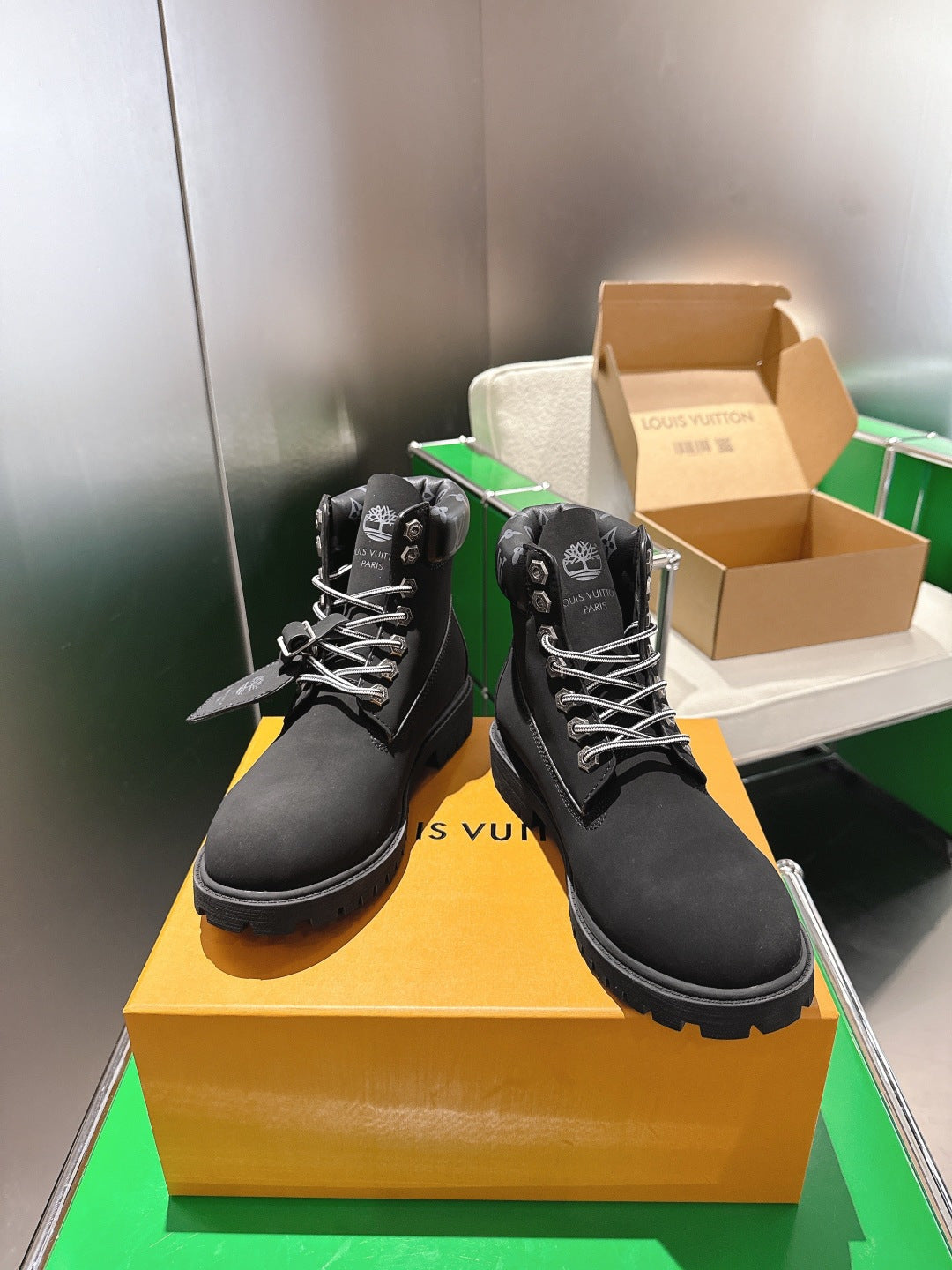 Louis Vuitton unisex black lace-up boots, front view on shoebox