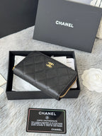 Quilted small bag side view with gold-tone zipper trim and CC emblem