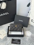 Quilted small bag with top zip closure, chain strap, and CC logo charm