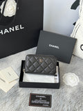 Chanel quilted small bag with top zip and chain strap, dark black color.