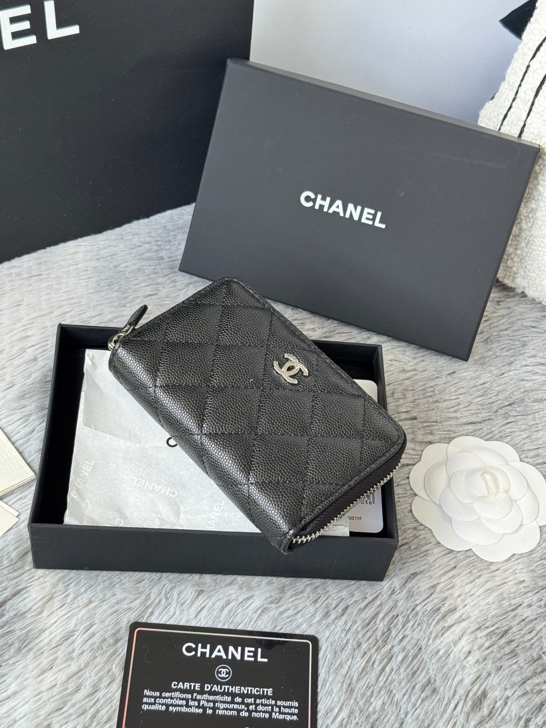 Chanel quilted small bag with zip closure and chain strap, dark black.